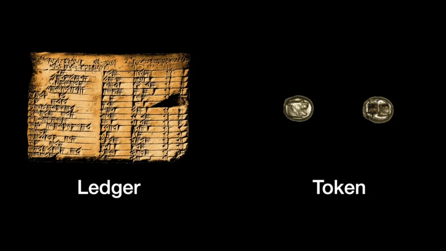 Diagram comparing a ledger, shown as an ancient Mesopotamian clay tablet with cuneiform writing, and a token, shown as two ancient silver coins, against a black background.