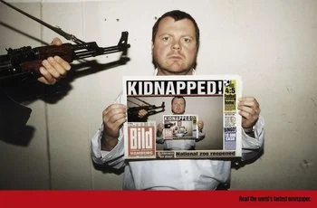 Proof of time: a kidnapping victim holds today's Bild newspaper, demonstrating the hostage is alive on a specific date, illustrating the concept of authentication by newspaper.